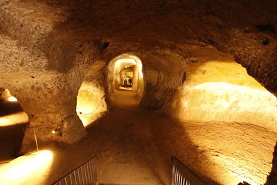 Low angle view of illuminated tunnel