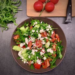 High angle view of chopped fruits in bowl on table