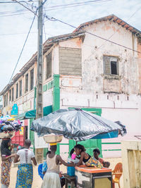 People at market stall in city