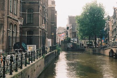 Canal amidst buildings in city