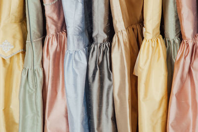 Close-up of colorful dress hanging on display at store