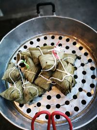 Close-up high angle view of stuffed food in leaves on container