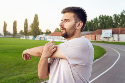 Side view of young man looking away