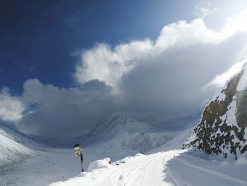 Scenic view of snow covered mountain against sky