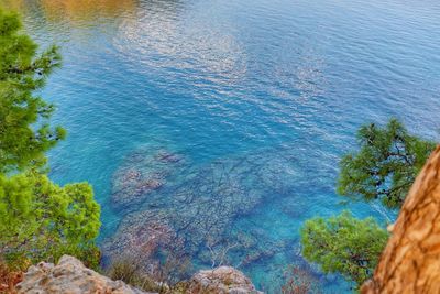 High angle view of rocks by sea