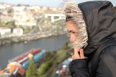 Side view of woman wearing warm clothing