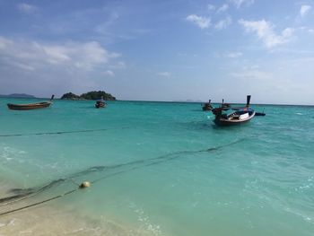 Boat in sea against sky