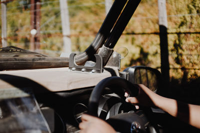 Close-up of hand on car