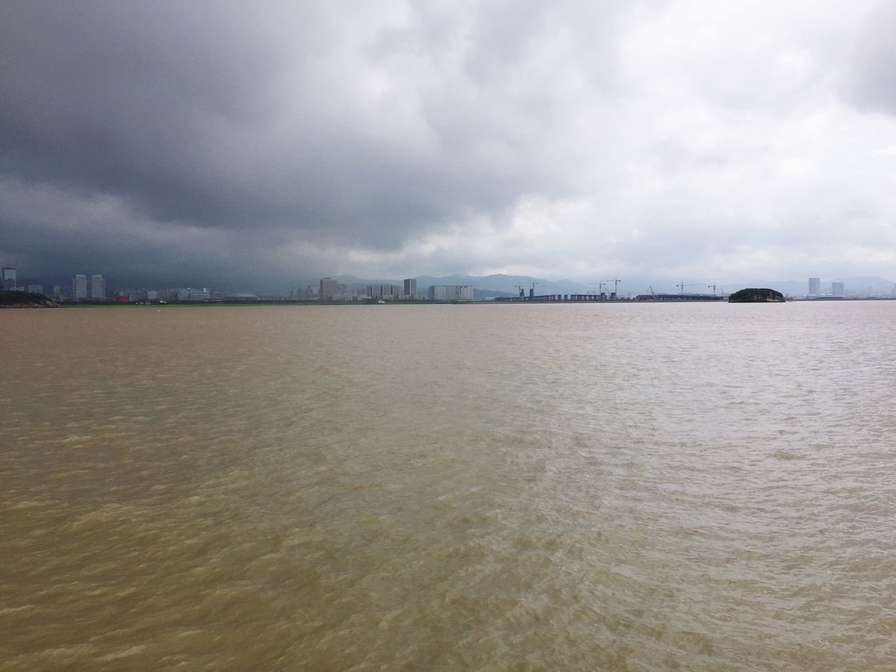 VIEW OF SEA AGAINST CLOUDY SKY