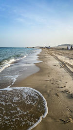 Scenic view of beach against sky