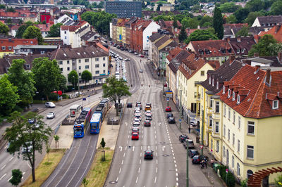 High angle view of traffic on street amidst buildings in city
