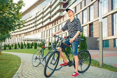 Hiker cyclist sitting on a bicycle. biker stopped on a city street