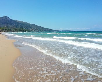 Scenic view of beach against clear sky