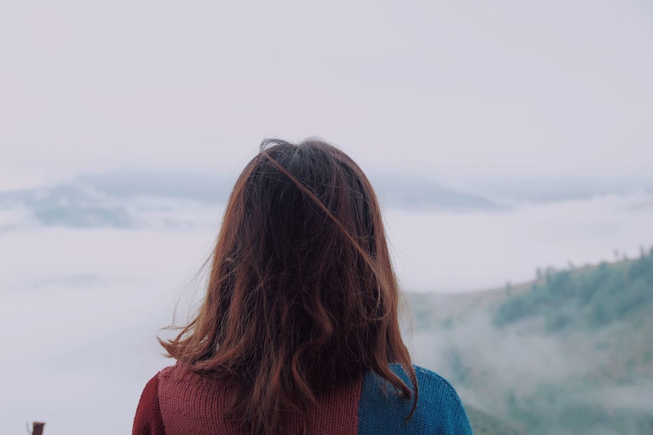 REAR VIEW OF WOMAN LOOKING AT VIEW OF MOUNTAIN