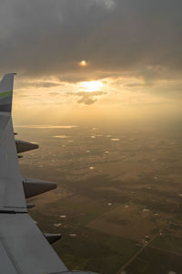 Aerial view of sea against sky during sunset