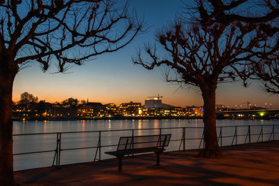 Scenic view of river against sky at sunset