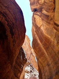 Low angle view of rock formation against sky