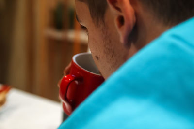 Close-up of young woman using mobile phone