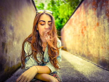 Woman sitting outdoors