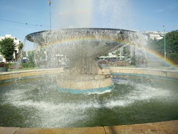 Fountain with buildings in background