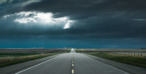 View of road against cloudy sky