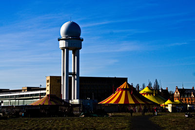 View of radar tower against cloudy sky