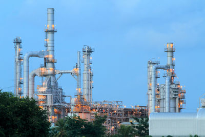 View of factory against blue sky