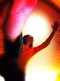 Low angle view of sun shining through window