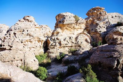 Low angle view of rocks against sky