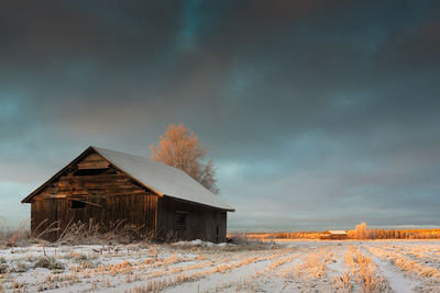 View of house against cloudy sky