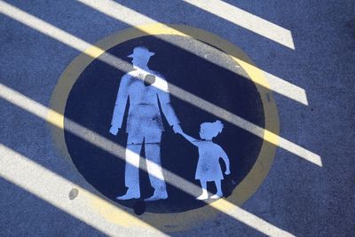 High angle view of road sign on street