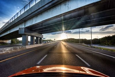 Cars on highway against sky