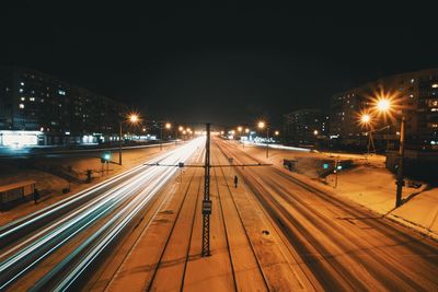 High angle view of illuminated railroad tracks during winter