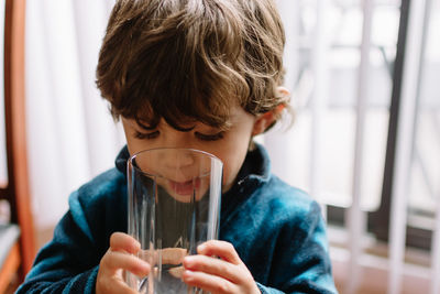 Portrait of boy drinking from glass