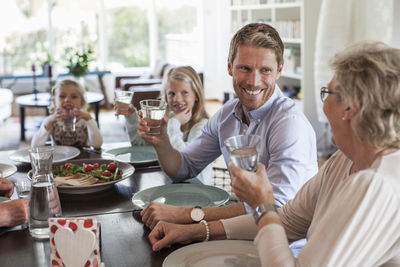 Happy family having lunch together at home