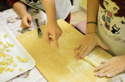 High angle view of woman preparing food on table