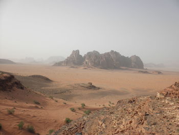 Scenic view of desert against clear sky