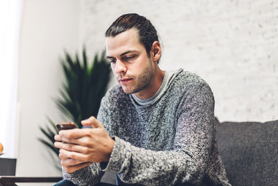 Young man using mobile phone