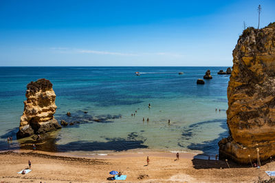 Scenic view of sea against blue sky