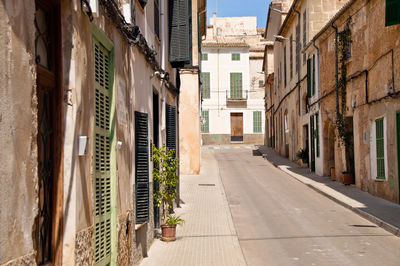 Narrow alley amidst buildings in city