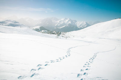 Scenic view of snowcapped mountains against sky