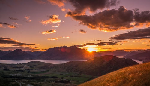 Scenic view of mountains against sky during sunset