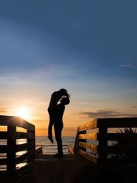 Silhouette of people at sunset