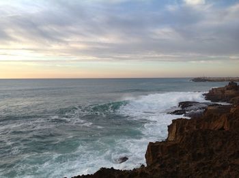 Scenic view of sea against dramatic sky