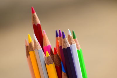 Close-up of colored pencils against white background