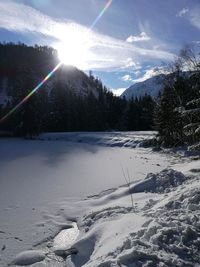 Scenic view of snow covered mountains against sky