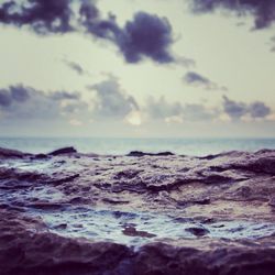 Surface level of beach against sky