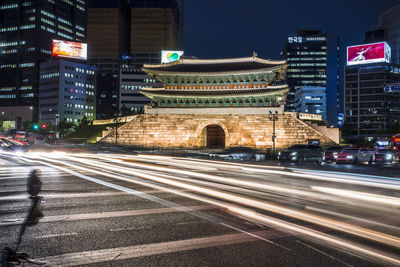 High angle view of light trails on road at night