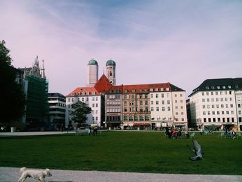 Buildings in city against sky