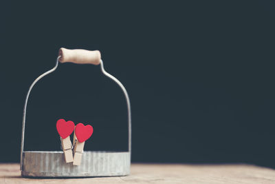 Close-up of red heart shape over black background